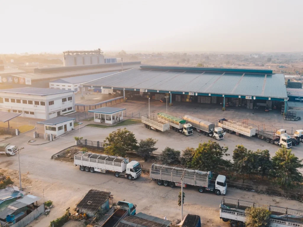 Aerial view of a large manufacturing plant where AED coverage must reach loading bays, yards and separate blocks