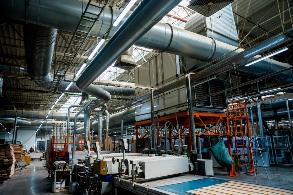 Interior of a manufacturing plant in Malaysia showing production machinery and equipment protected by a factory perimeter security system