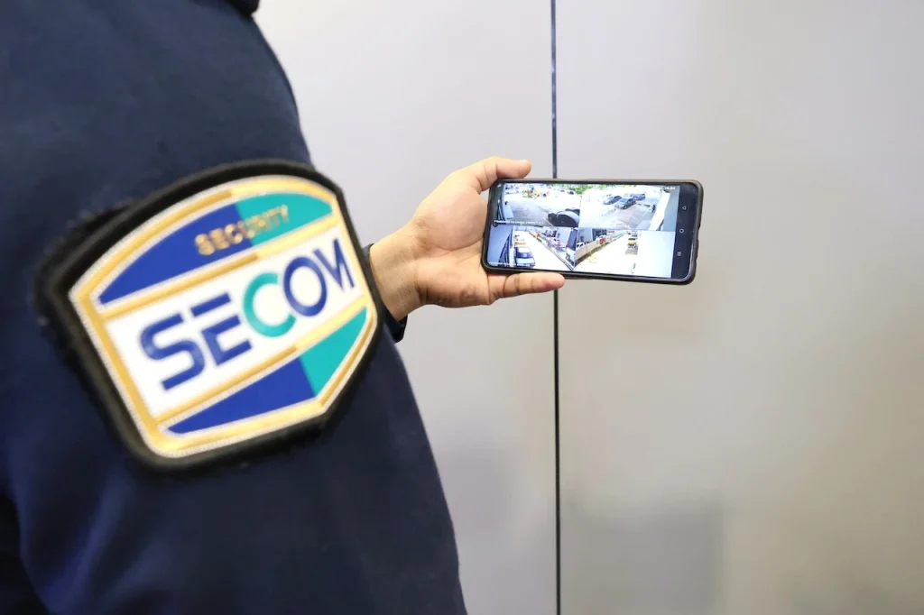 SECOM Malaysia guard using mobile CCTV monitoring for site security checks