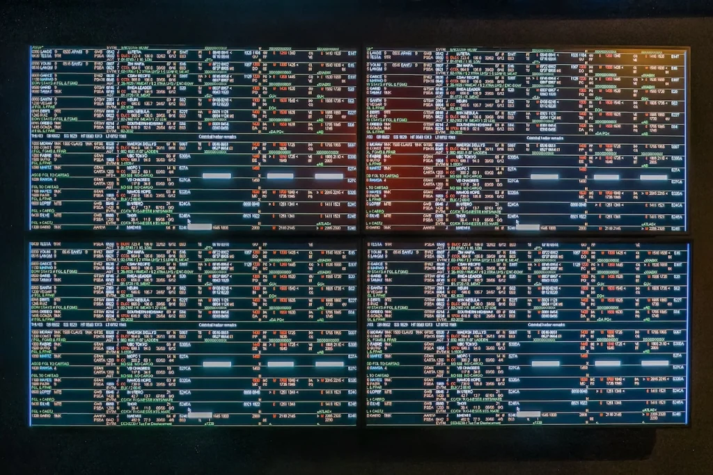 Central monitoring system screens displaying multiple alerts and data, highlighting the impact of high false alarm rates.