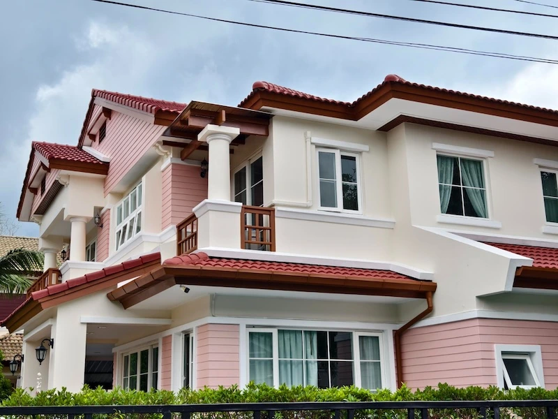 landed-house-home-security-malaysia Two-storey landed house in Malaysia with a CCTV camera mounted under the roof eave